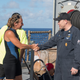 USS Ashland Command Master Chief Gary Wise welcomes aboard Jennifer Appel, an American mariner who had received assistance from Ashland crew members. (U.S. Navy photo by Mass Communication Specialist 3rd Class Jonathan Clay/Released)
